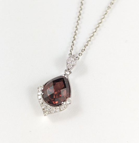 9ct White gold Garnet and Diamond pendant and chain